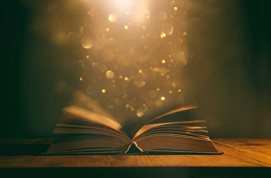 An open book sparkling magically 