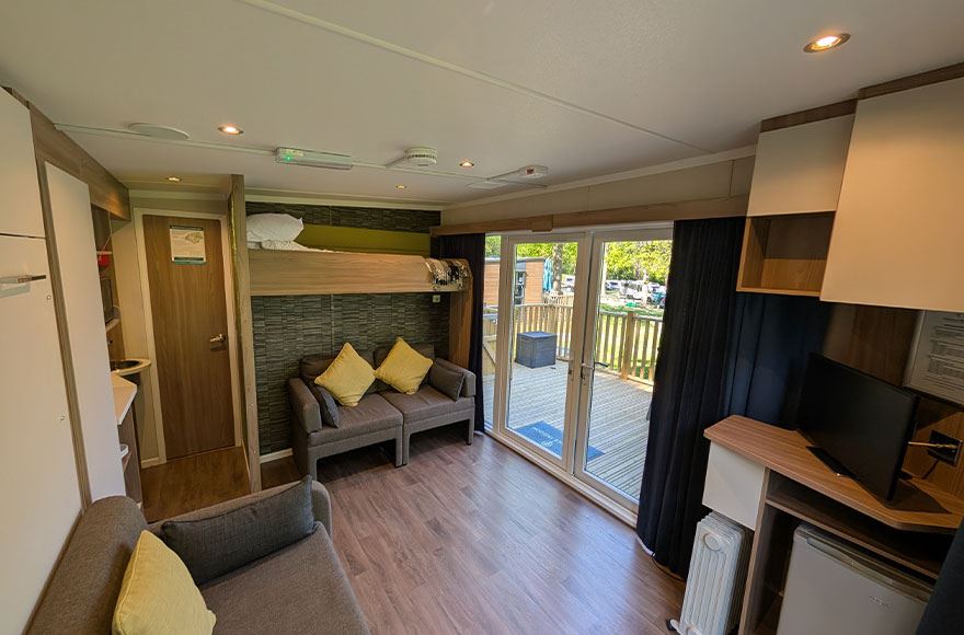 The interior of the glamping pod at Abbey Wood campsite, London. The image is taken from the corner looking our over the space.