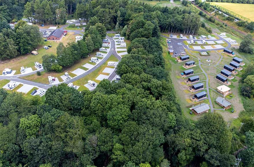 An aerial view of Lady Margaret's Park glamping area on one side and the campsite on the other
