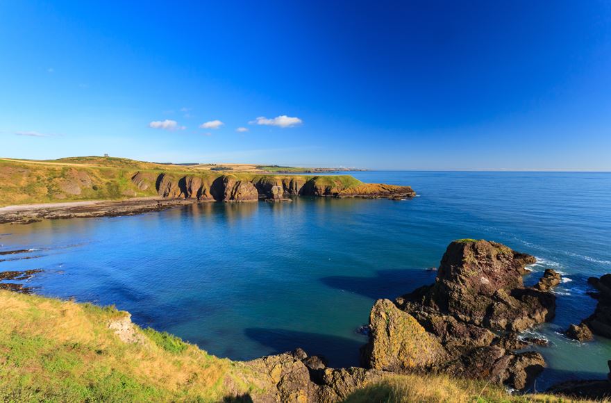 Ocean view from cliff top showing the calm waters of Stonehaven bay