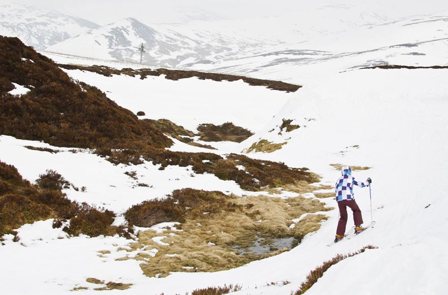 woman On skis on a snowy mountain