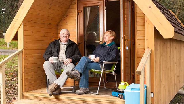 couple enjoying drink on the decking
