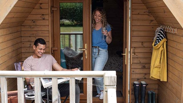 couple relaxing on the decking