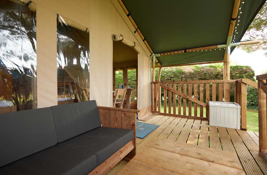 Relaxing outdoor decking area with a couch and table, great for lounging