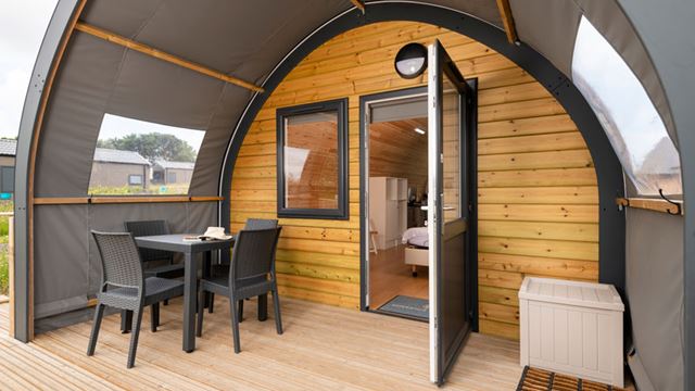 Decking area featuring table and chairs