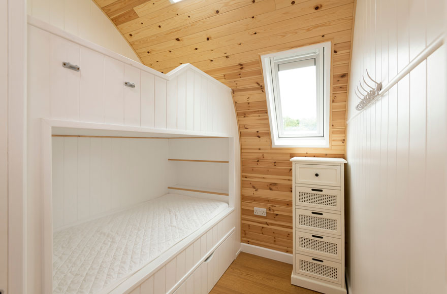 bedroom with bunk bed and dresser