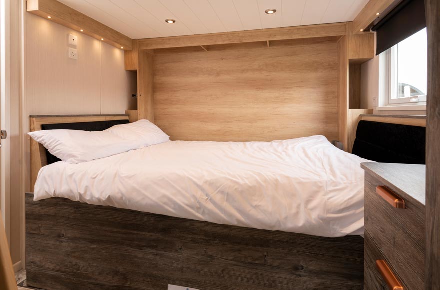 Cozy bedroom with bed and bedside table