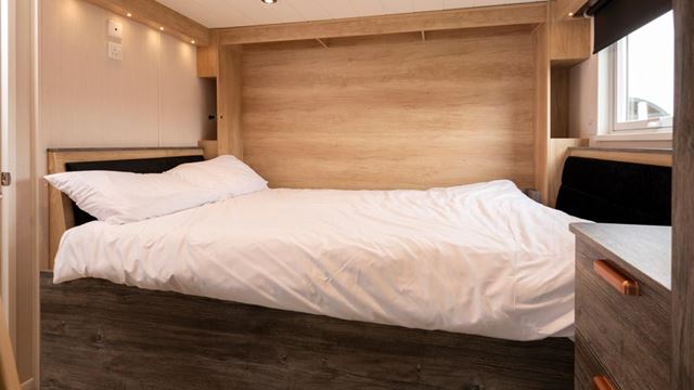 Cozy bedroom with bed and bedside table