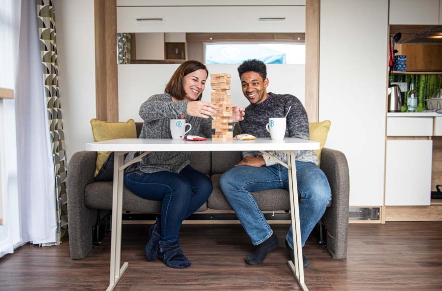 couple playing games on the sofa 