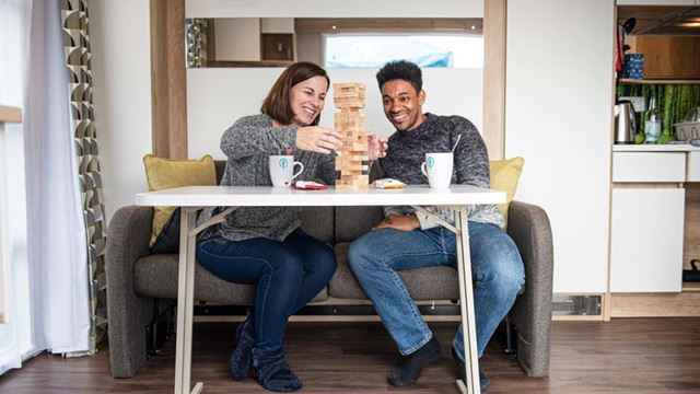 couple playing games on the sofa