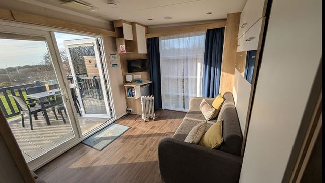 Interior of glamping pod with the sun shining in