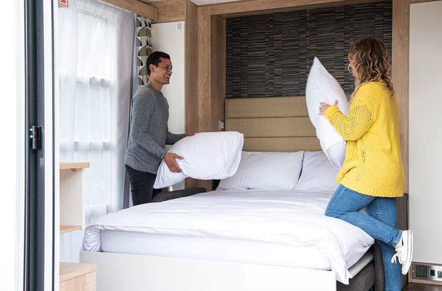 couple making the bed