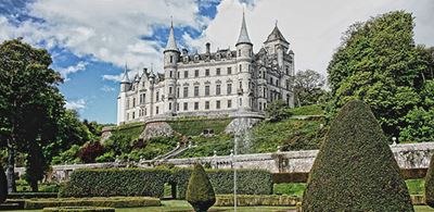 Dunrobin Castle on a hill surrounded by trees