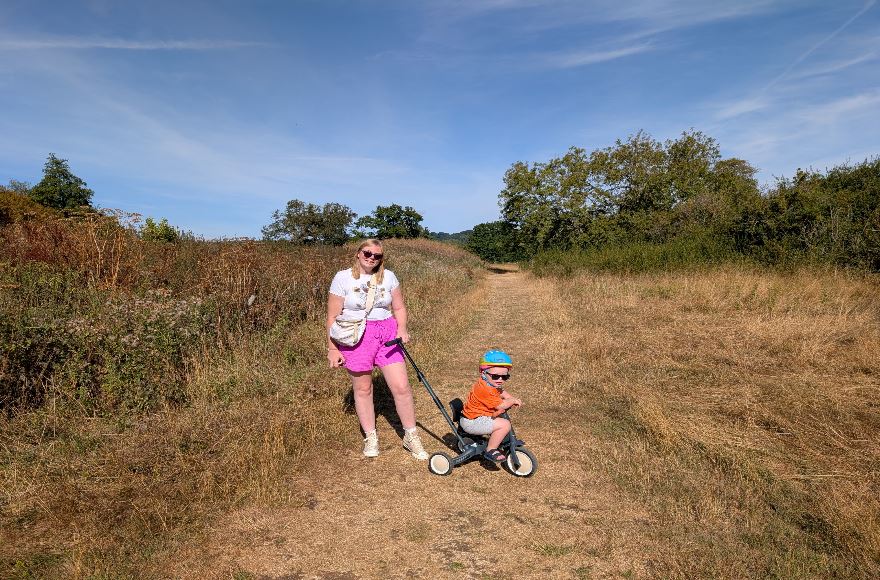 Mum and toddler enjoying the accessible walking route to Batsford Arboretum
