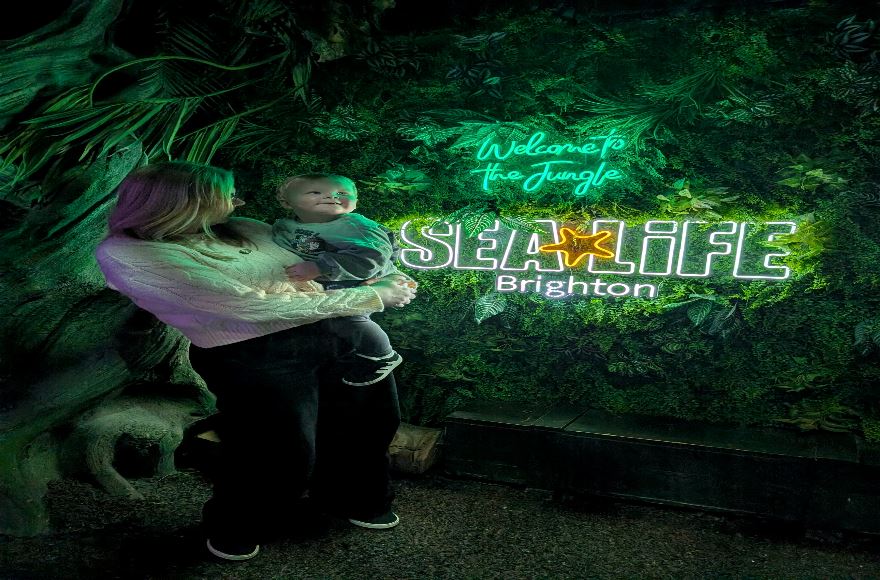 Mum and toddler enjoying Sea Life Brighton