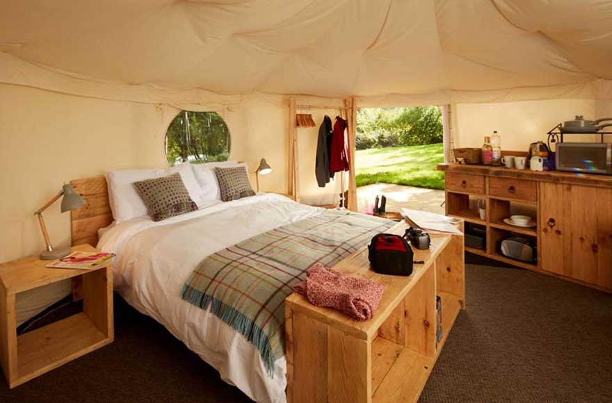 Enjoy plenty of space and a comfy king sized bed in our luxurious yurts